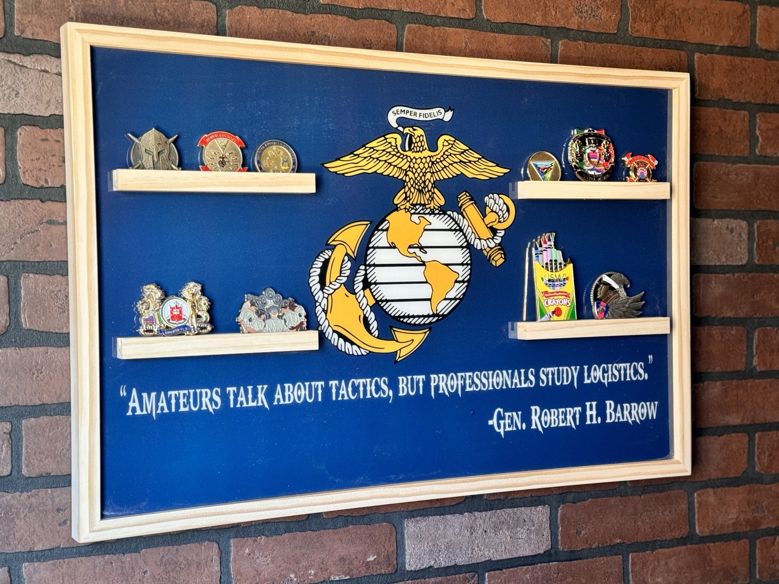Framed color coin display with a blue background