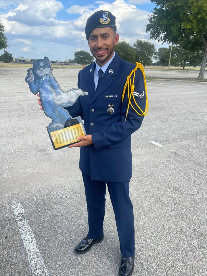 Customer in dress uniform holding a personalized character plaque