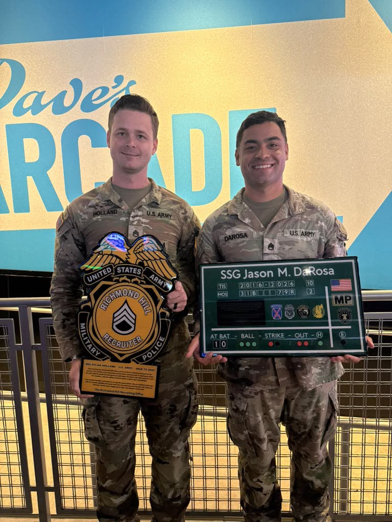Two customers in Army uniforms holding custom plaques