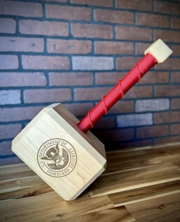 Personalized maple Thor hammer with a red cord-wrapped handle and engraved seal