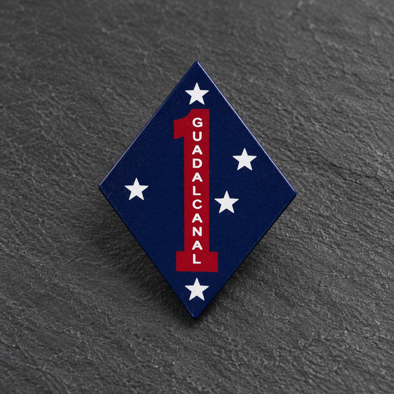 Navy diamond Guadalcanal pin with a red number 1 and five white stars