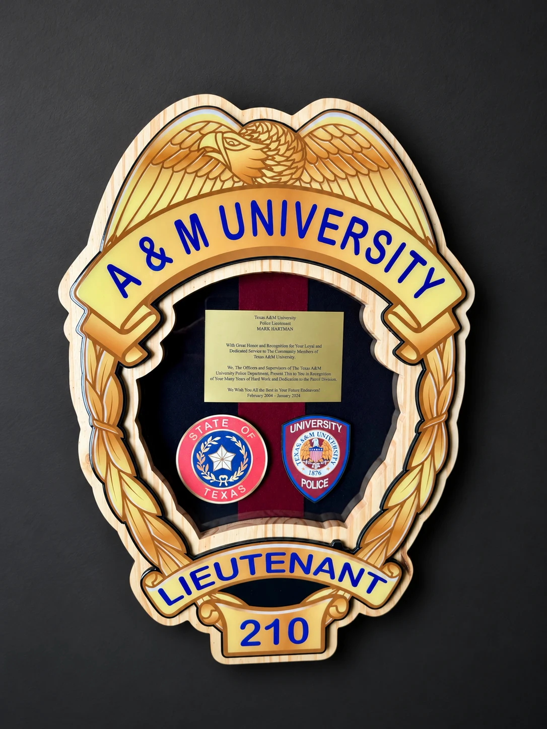 Texas A&M University police badge shadow box with a plaque and patches