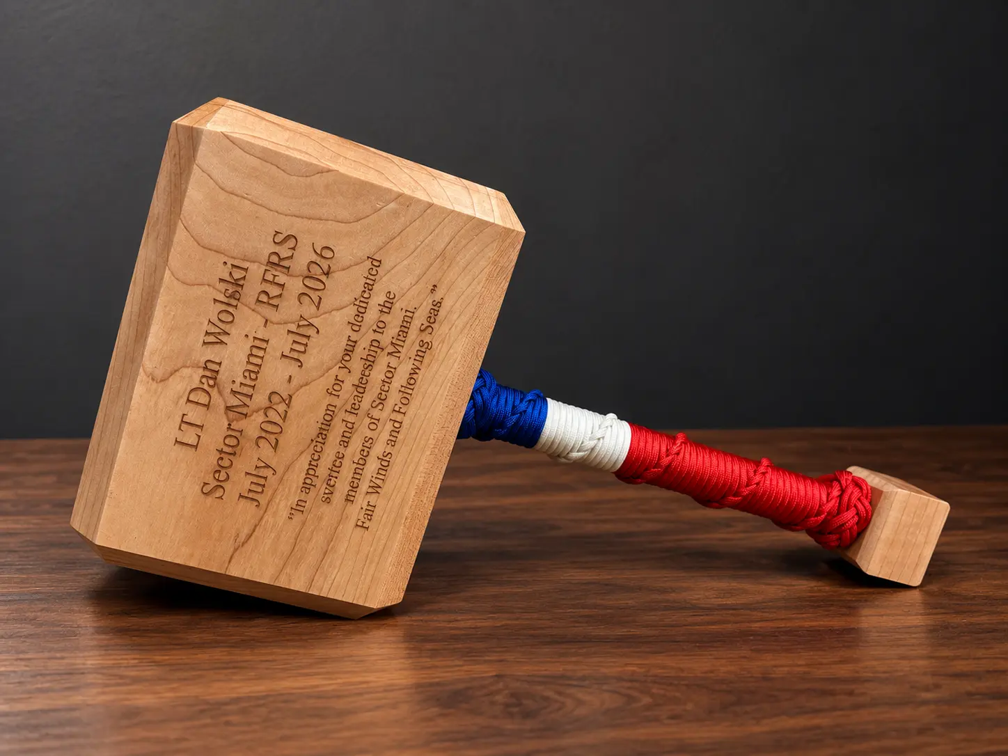 Maple Thor hammer with a personalized Coast Guard retirement message and a blue, white and red rope wrap