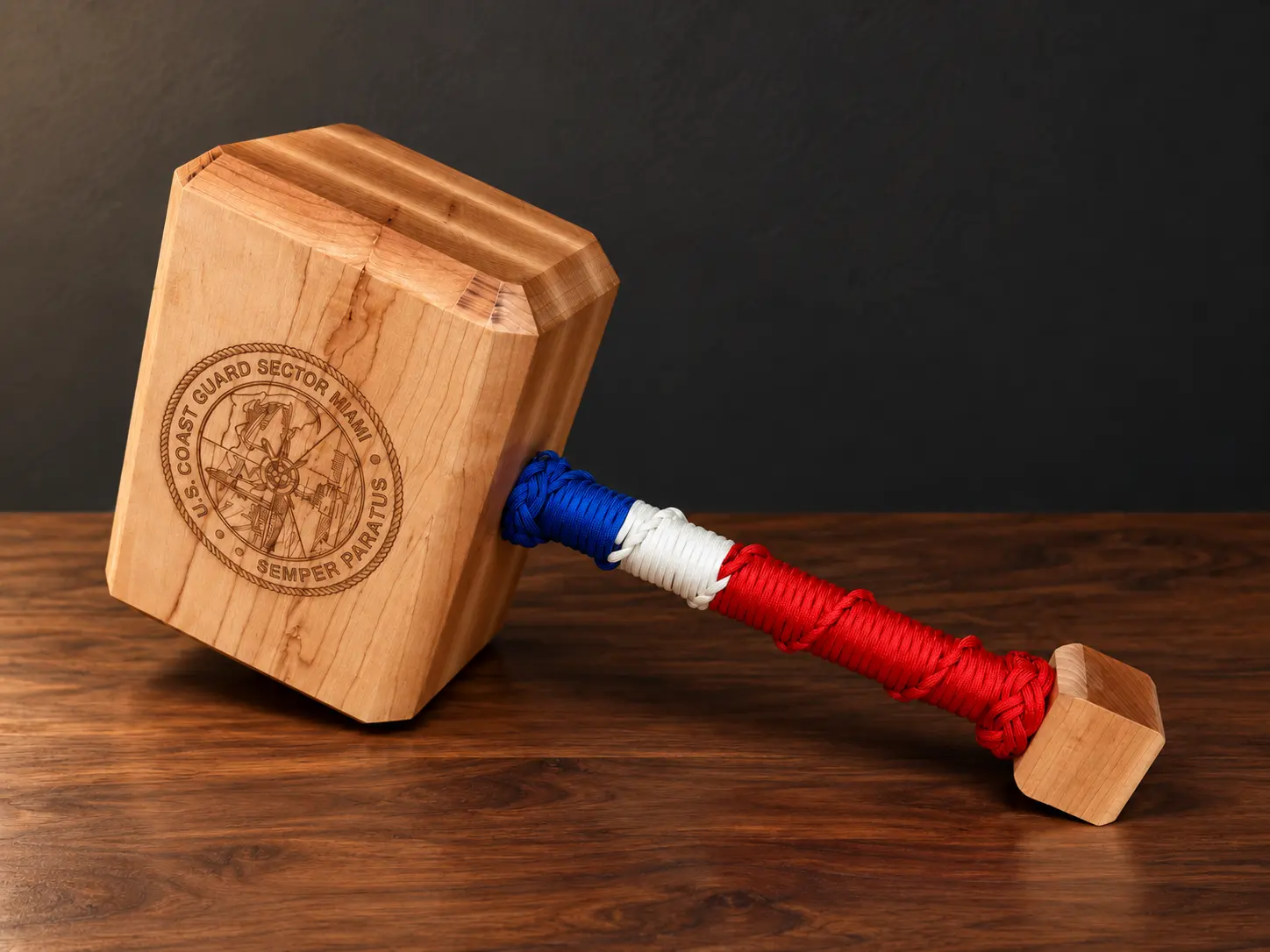 Thor hammer with a Coast Guard Sector Miami seal and blue, white and red handle wrap